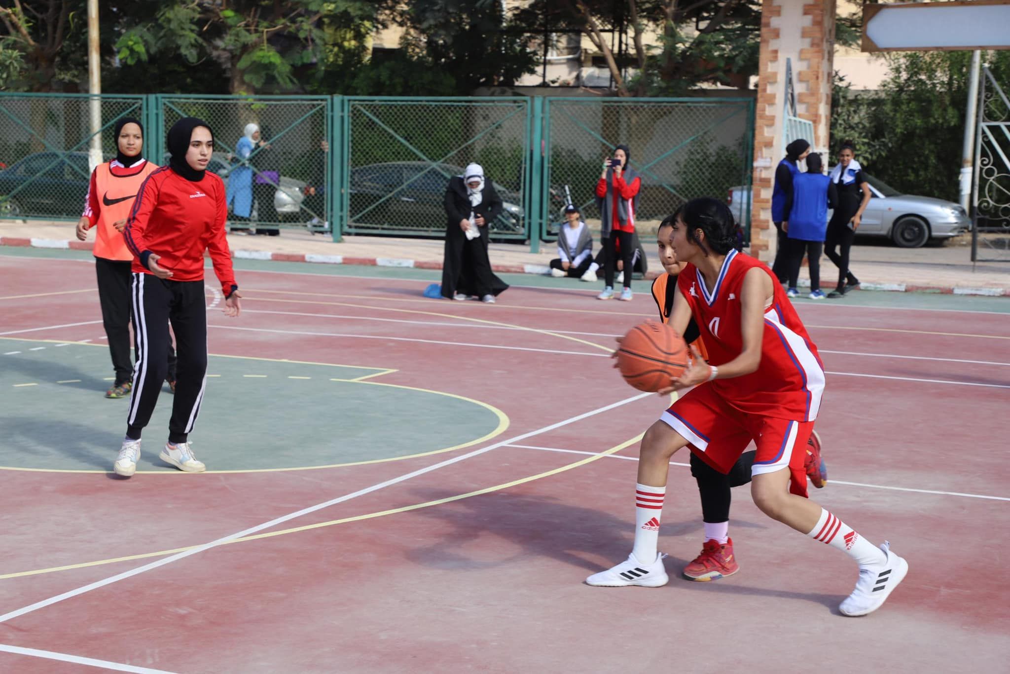 May be an image of 9 people, people playing basketball and basketball jersey